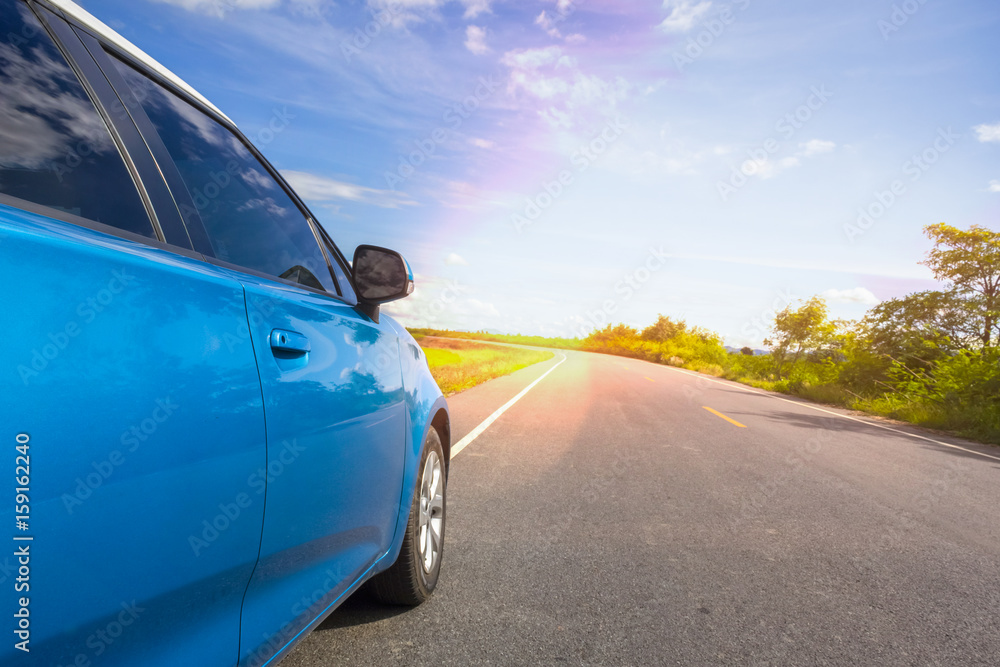 car on load and bright sky