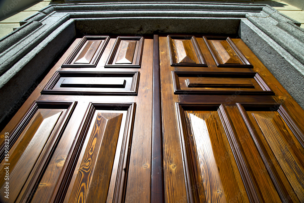 sumirago knocker in a door curch wood italy lombardy sumirago knocker in a door curch wood italy lombardy