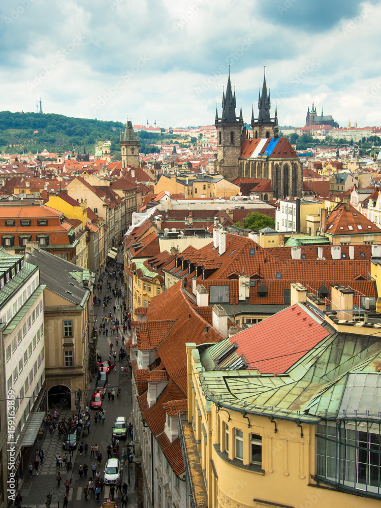 Obraz premium prague, view over tyn church with saint vit cathedral in the background taken from powder tower 