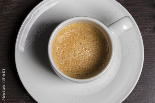 Espresso coffee on a white dish isolated