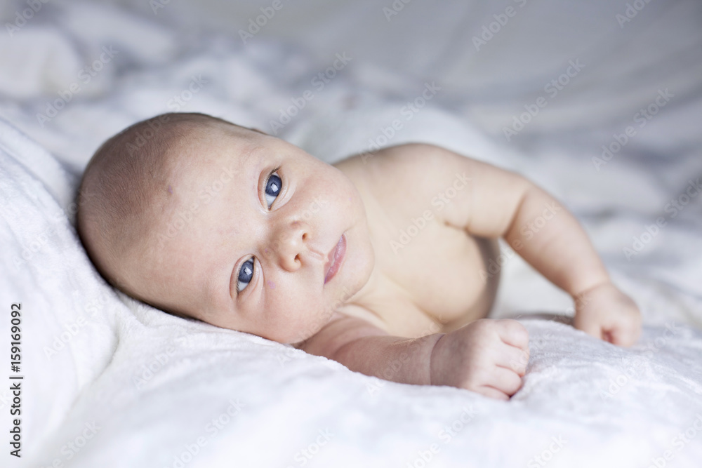 Beautiful baby girl on white blanket Beautiful baby girl on white blanket