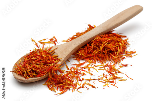 Saffron with wooden spoon photo