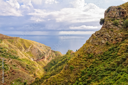Rocky landscape and the Ionian Sea from road to Castelmola - Taormina, Sicily, Italy