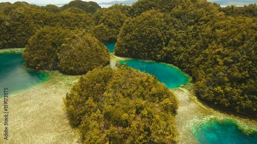 Aerial view: Bucas Grande Island, Sohoton Cove. Philippines. Tropical sea bay and lagoon, beach. Tropical landscape hill, clouds and mountains rocks with rainforest. Azure water of lagoon. Shore photo