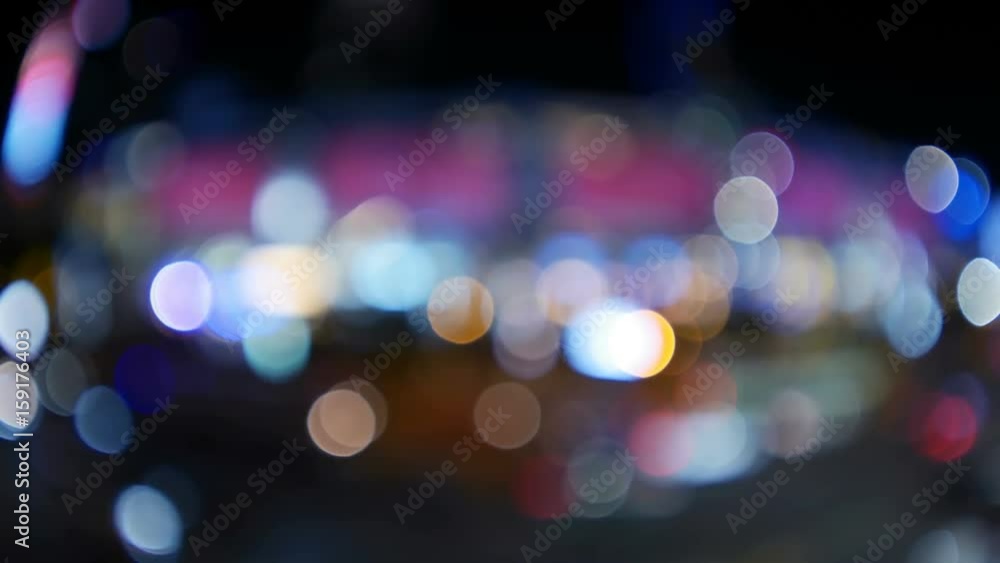 Out of focus lights of a street at night (Time-lapse) Out of focus lights of a street at night (Time-lapse)