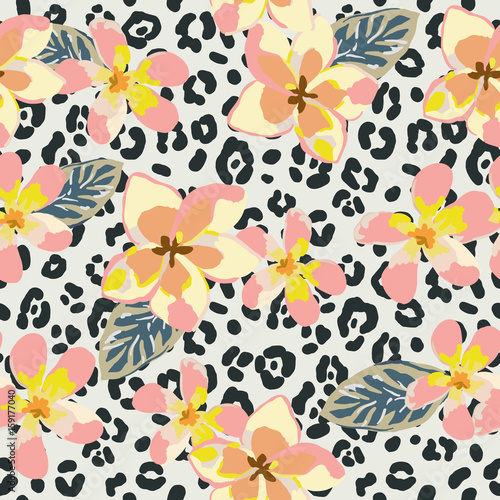 Pink plumeria flowers on the animal print background. Vector seamless pattern. Tropical summer illustration.