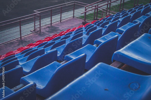 Tribune stadium with blue and red seats
