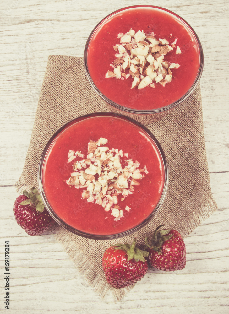 Strawberry smoothie with fresh fruit . Strawberry smoothie with fresh fruit .