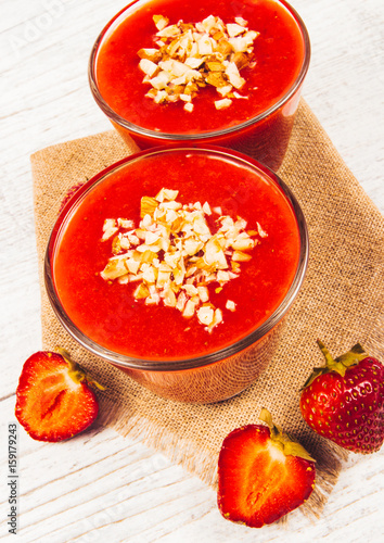 Strawberry smoothie with fresh fruit .