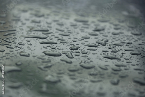 rain drops on car with glass coating protection skin
