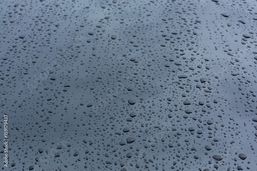 rain drops on car with glass coating protection skin