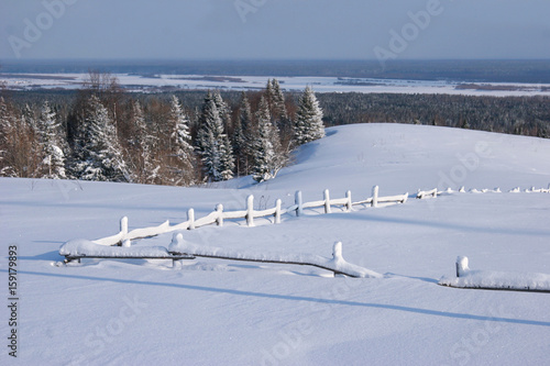 Snow-covered fence at the top of snow winter mountain © anton_shoshin