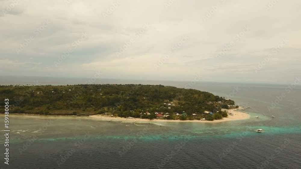 Aerial view of tropical beach on the island pamilacan, Philippines. Beautiful tropical island with sand beach, palm trees. Tropical landscape: beach with palm trees. Seascape: Ocean, sky, sea. 4K Aerial view of tropical beach on the island pamilacan, Philippines. Beautiful tropical island with sand beach, palm trees. Tropical landscape: beach with palm trees. Seascape: Ocean, sky, sea. 4K