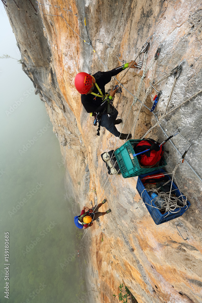 Extream Climber set a camp on the side of a mountain Bigwall .Kanchanaburi Province Thailand, 7 August 2012