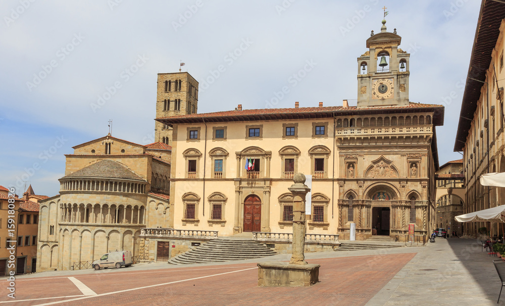 Arezzo in Tuscany, Italy - Piazza Grande; from left - Church Santa Maria della Pieve, old Tribunal Palace and Palace Lay Fraternity.