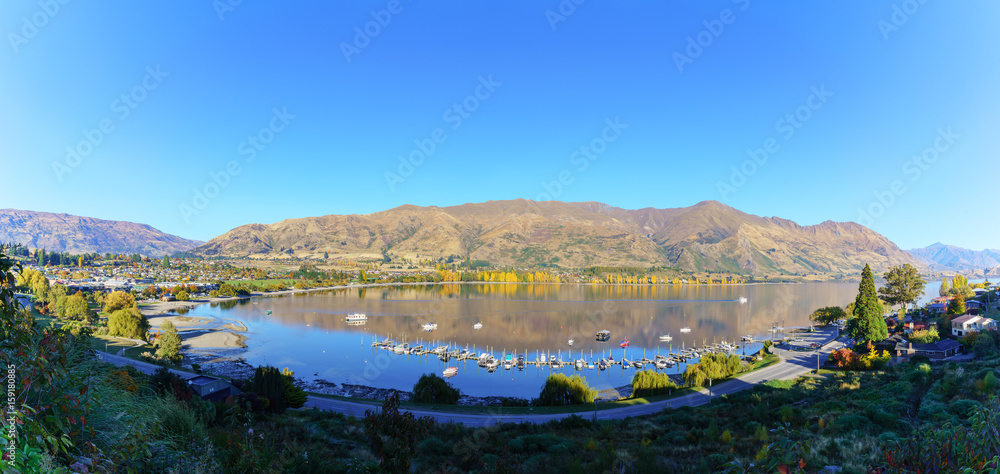 Panoramic image of Lake Wanaka in the morning in Autumn , Wanaka , South Island of New Zealand