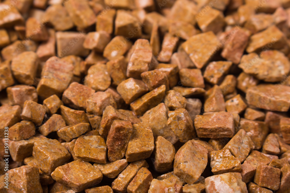 beautiful natural red stone scattered on a white background beautiful natural red stone scattered on a white background