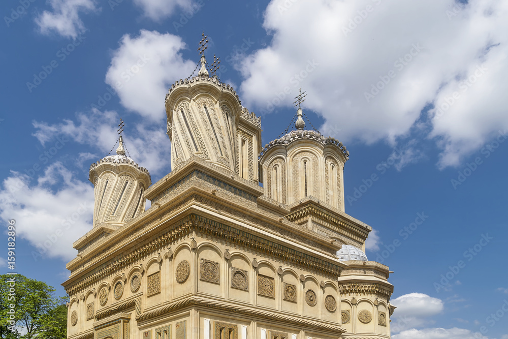 Detail of the top of the Curtea de Arges Monastery and Cathedral on a sunny day, Romania