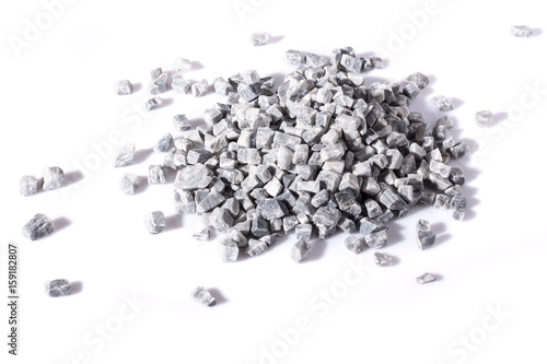 beautiful natural gray stones scattered on a white background