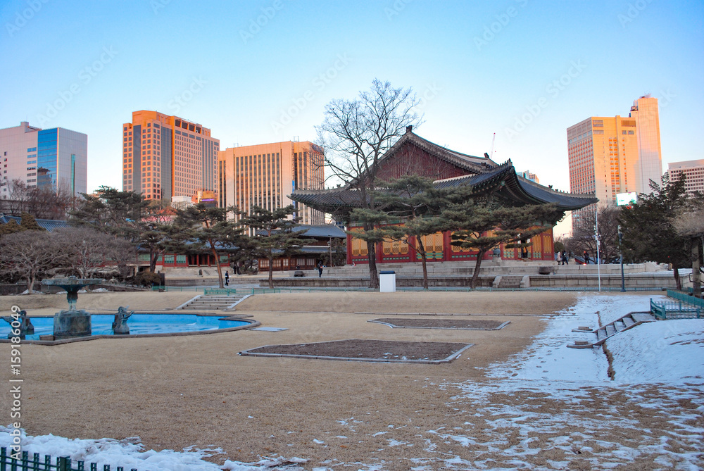 Beautiful nature,public park covered by snow during winter at sunny day and blue sky