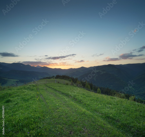 Sunset in the mountain valley. Beautiful natural landscape in the summer time