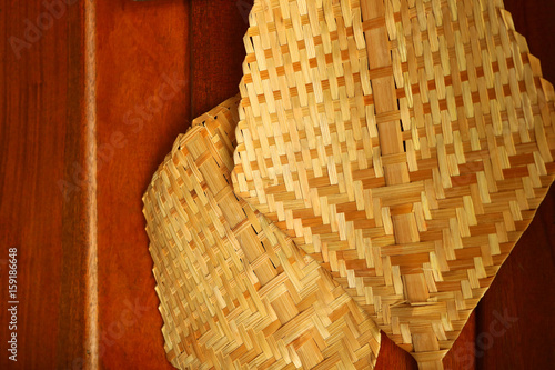 Fotografie bamboo weave fan on board wall