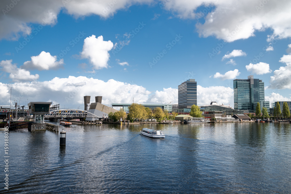 Panoramic view of  the canals in Amsterdam with boats, famous touristic city, Netherlands