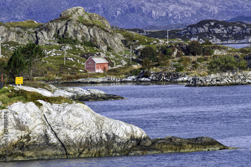 Waterfront con rugged shoreline of Floro, on Brandsoya island, Norway photo