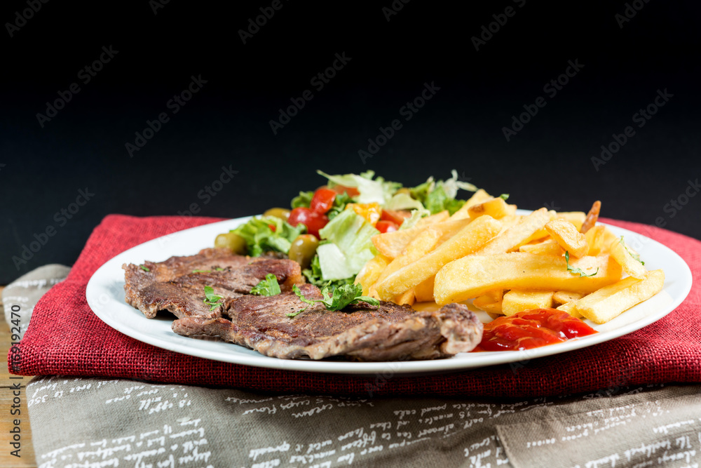 juicy steak beef meat with tomato and french fries juicy steak beef meat with tomato and french fries