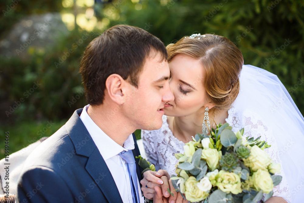 Wedding couple is hugging each other. Man in suit. Beauty bride with groom. Female and male portrait. Wedding couple in love, close-up portrait of young and happy bride and groom Wedding couple is hugging each other. Man in suit. Beauty bride with groom. Female and male portrait. Wedding couple in love, close-up portrait of young and happy bride and groom