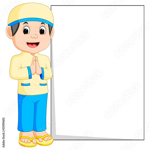 Happy muslim boy cartoon holding blank sign