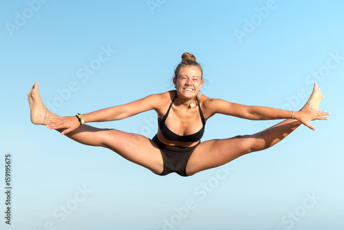 Girl jumping in the beach