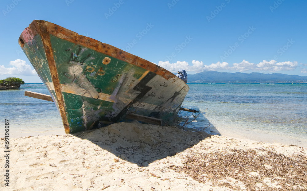 Wreck on white tropical beach - Le Gosier island - Guadeloupe Caribbean sea