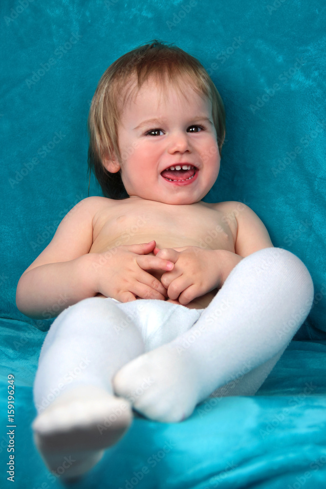Lachendes Baby Mädchen mit Windel und Strumpfhose Stock Photo | Adobe Stock