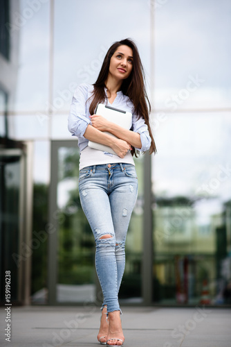 Beautiful girl smiling with the tablet.