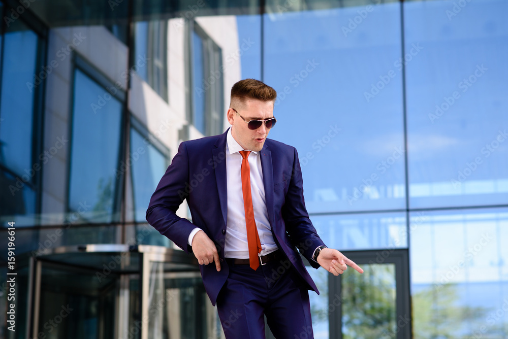 A successful businessman is smiling. A successful businessman is smiling.