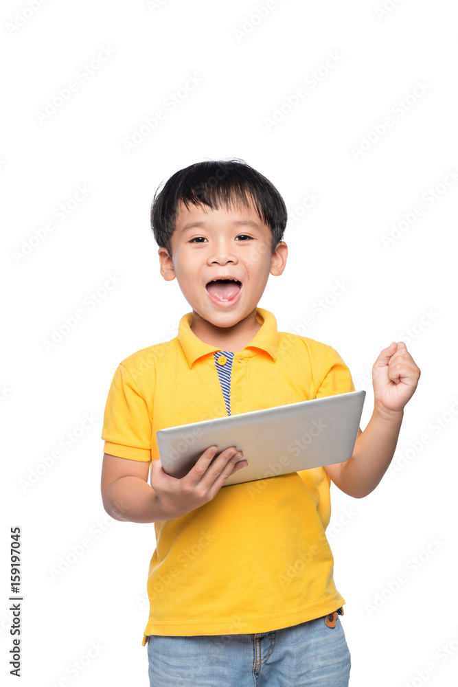 Portrait of cheerful boy with backpack holding digital tablet with hand raised Portrait of cheerful boy with backpack holding digital tablet with hand raised