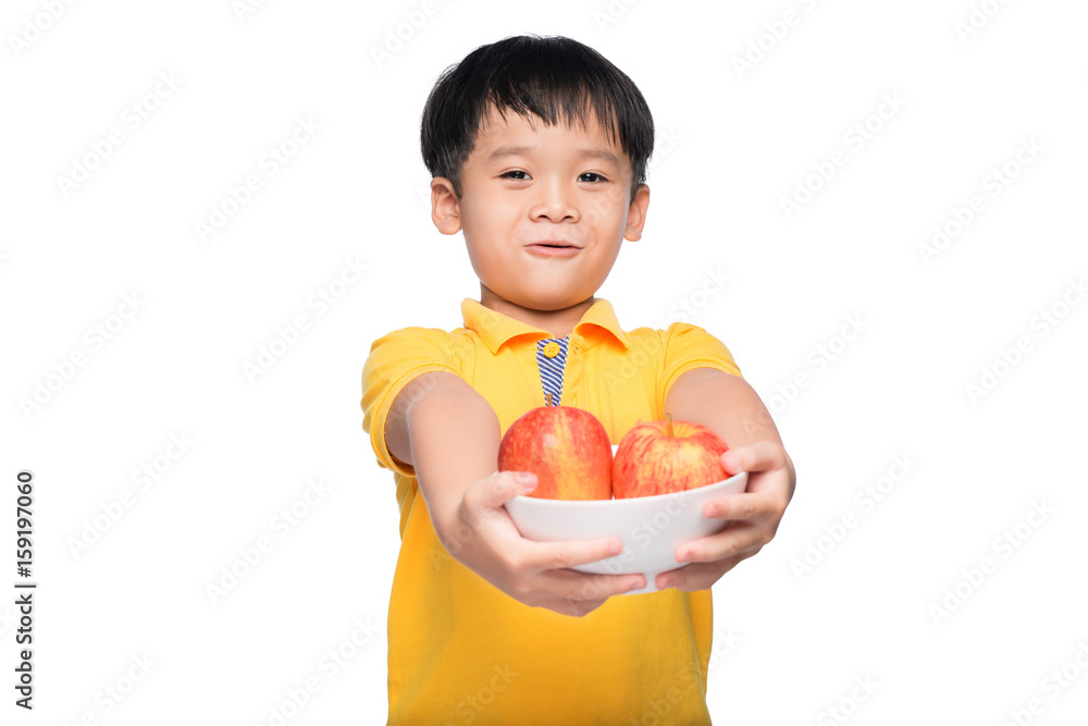 Happy Asian boy holding red apple in bowl. Happy Asian boy holding red apple in bowl.