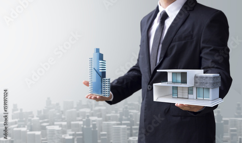 business man select modern house and building