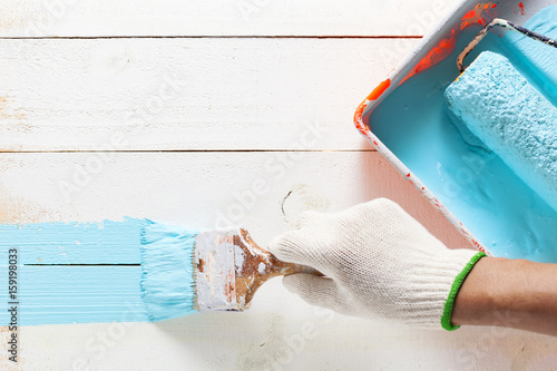 Wallpaper Mural Hand painting blue color on wooden table. Torontodigital.ca