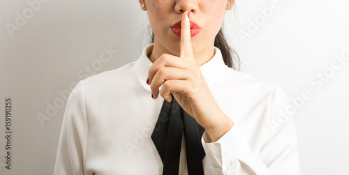 Shhhhh! Businesswoman requiriong silence photo