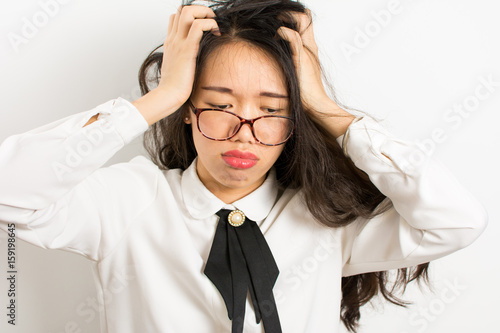 Tired asian businesswoman with glasses