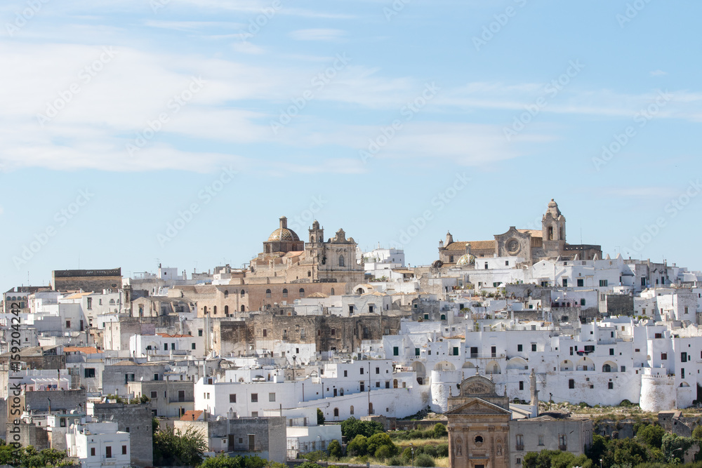 Ostuni, Italy - May 26, 2017: Panoramic view of the white city from the fields nearby