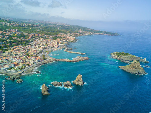 Cyclops islands, Acitrezza, Sicily. Basalt rocks on the sea view from top - Catania, Sicily - Italy photo