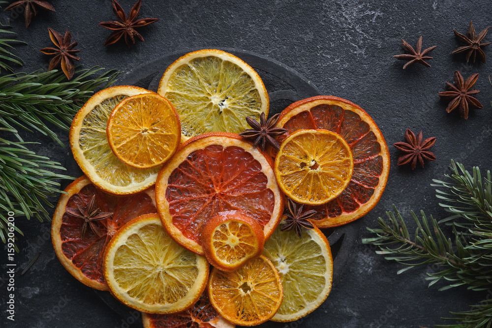 Caramelized citrus on a dark background, Mulled wine ingredients, Top view, Close-up, Horizontal Caramelized citrus on a dark background, Mulled wine ingredients, Top view, Close-up, Horizontal