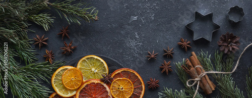 Caramelized citrus on a dark background, Mulled wine ingredients, Top view, Copy space, Bunner, Horizontal