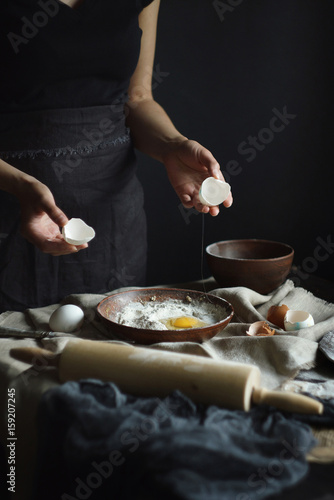 Wallpaper Mural Women's hands are preparing home-made raw noodles, Rustic, Selective Focus, Atmospheric dark tone Torontodigital.ca