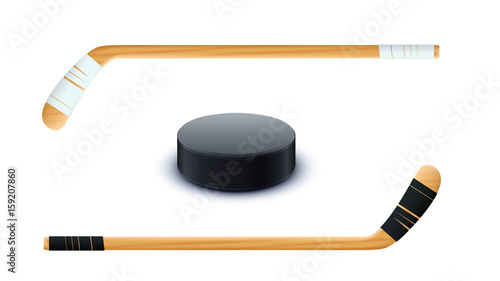 couple sticks and puck