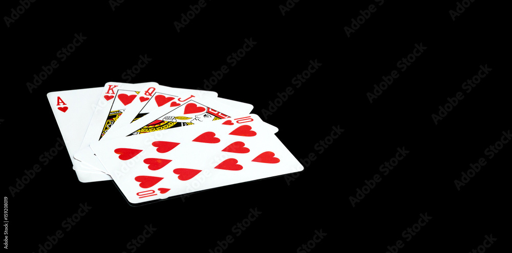 Playing cards on a black background.