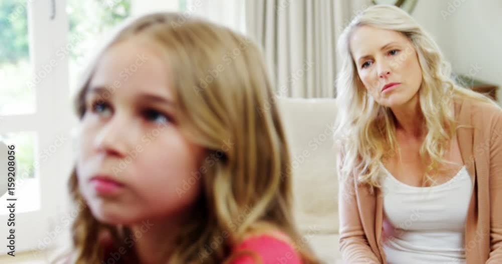 Mother arguing with her daughter in living room Mother arguing with her daughter in living room